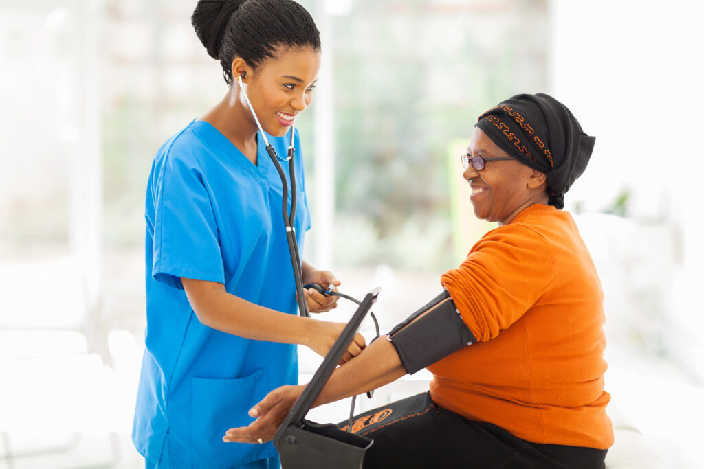 Care Services african nurse checking senior patient